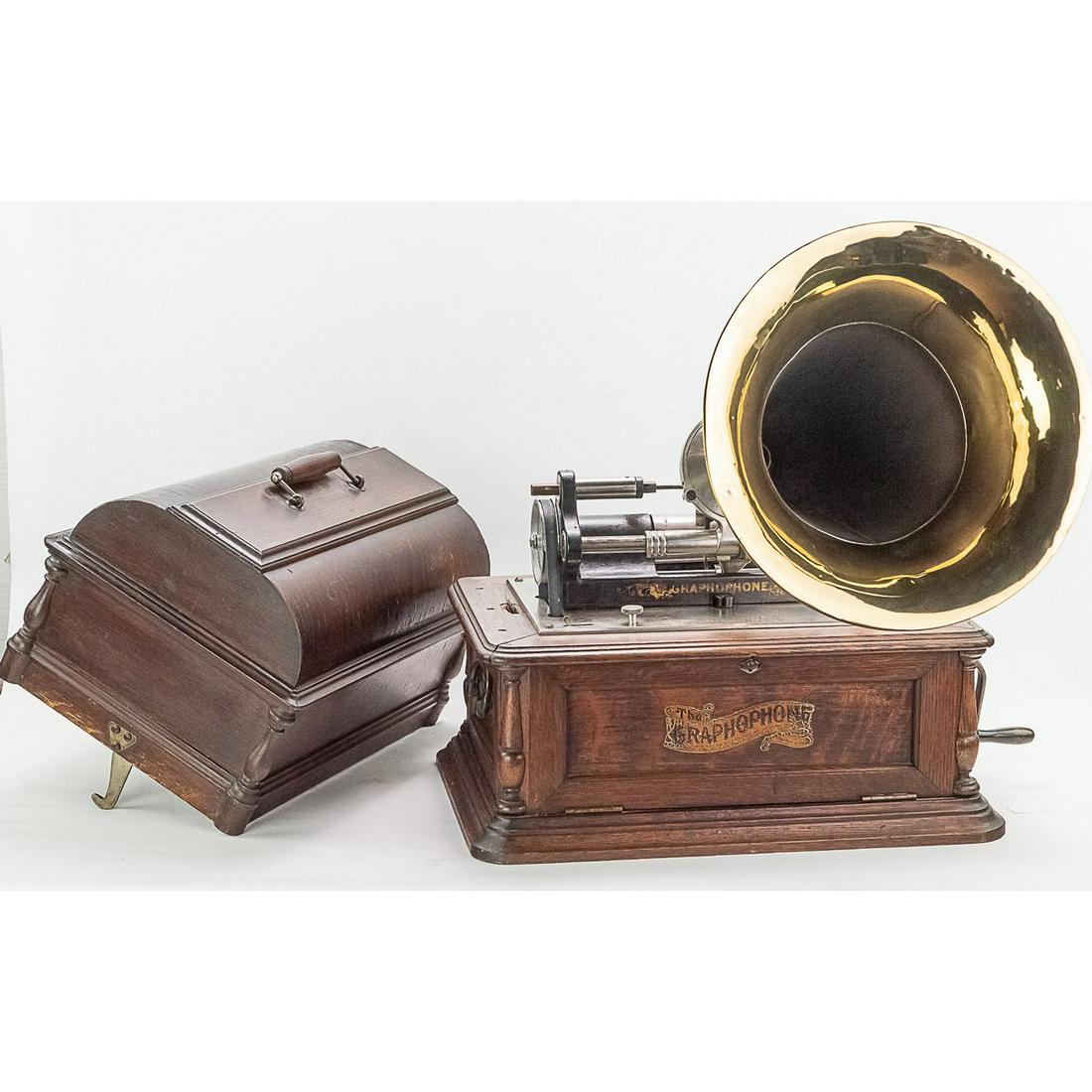 Columbia BC 20th Century Cylinder Phonograph: This massive machine in its elaborate cabinet has its original brown oak finish which is well worn and weathered throughout. Top cover has evidence of several old repairs and is dark and stained. This