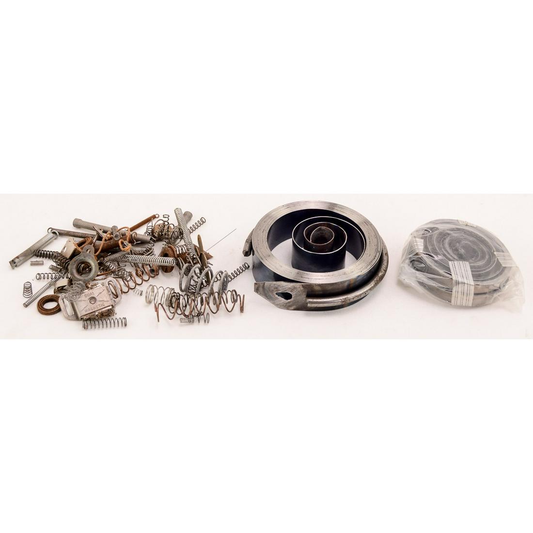 Lot of Phonograph Main Springs and More: This lot consists of two new phonograph main springs and various used compression and tension springs. From the Howard Hazelcorn collection.