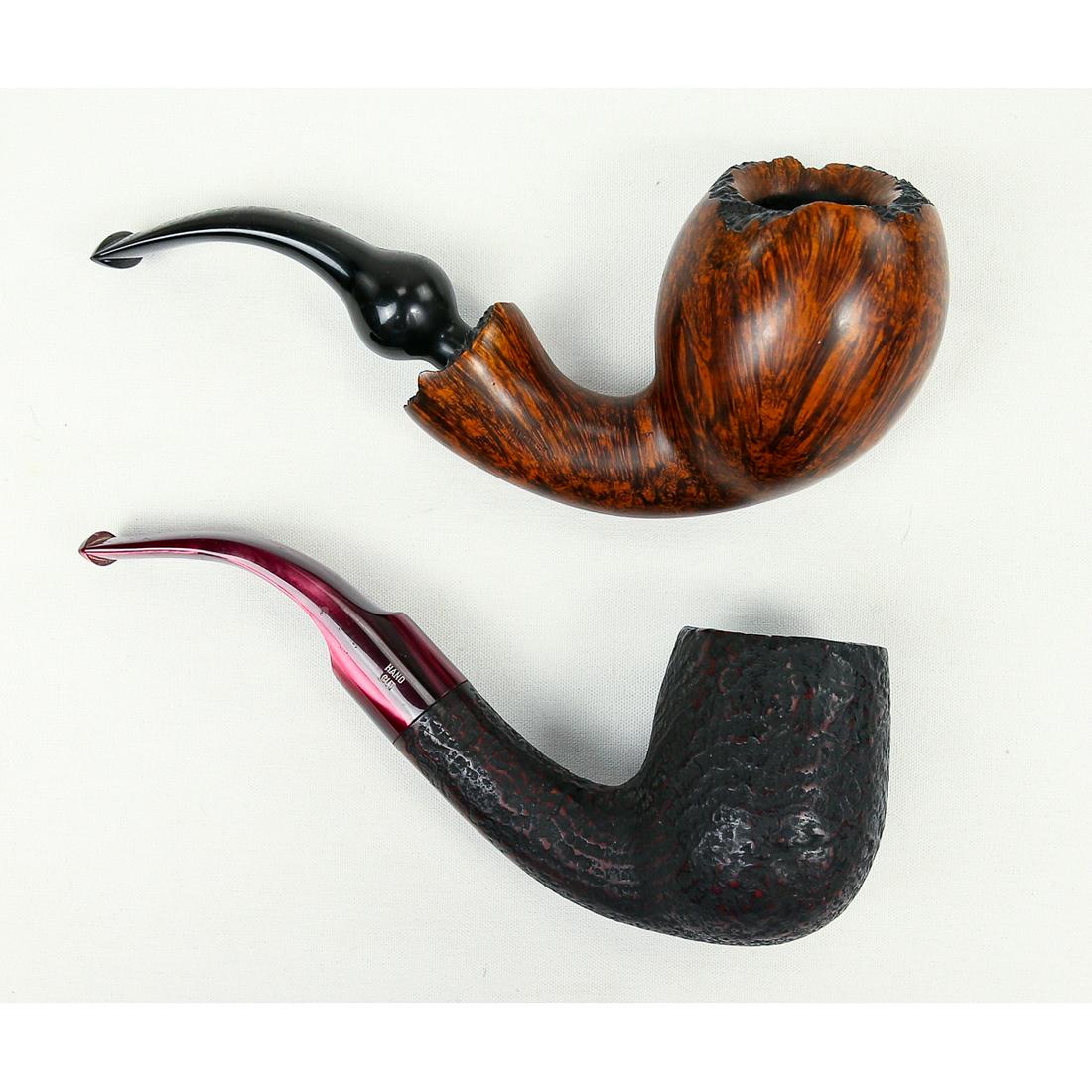 2 Bari Wiking Large Rustic, Artistic Briar Pipes: Made in Denmark, these pipes are in great shape. The large, rustic, bent billiard pipe has a thin layer of cake and slight chatter on the red marble lucite stem. The smooth artistic pipe has a black v