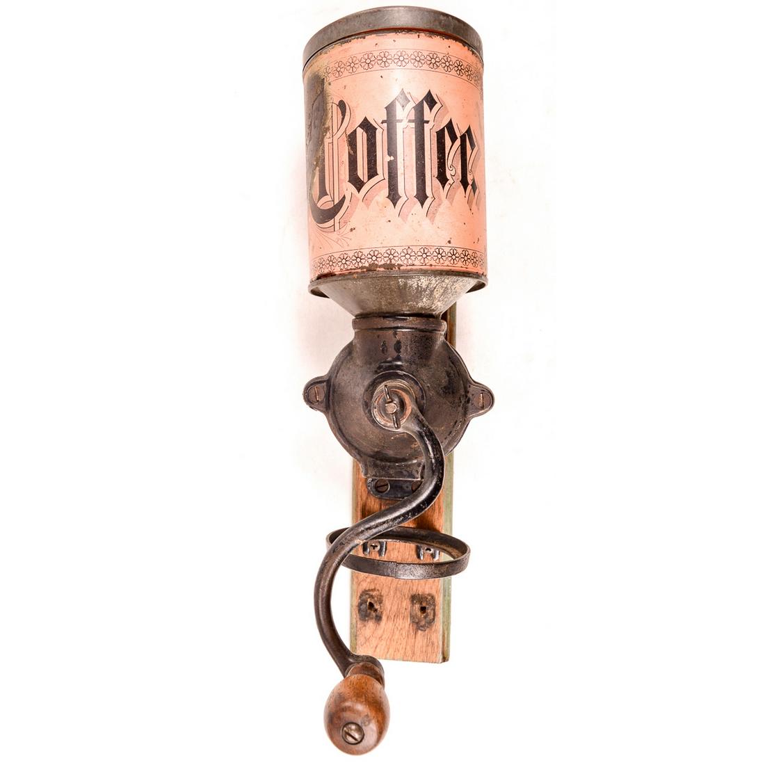Tin Top Wall Coffee Grinder: Scarce tin can top model wall mount coffee grinder in good condition. Cast iron mechanism complete including bracket for grounds can. Top tin bean hopper has lid and partial original litho paint that 