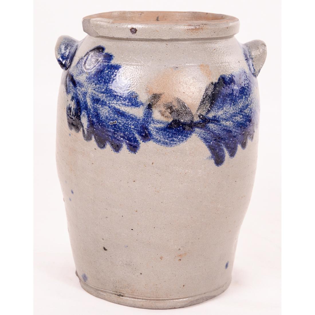 Decorated Floral Cobalt Blue Stoneware Crock Jar: Decorated Floral Cobalt Blue Stoneware Crock Jar with handles. 10" x 7 1/2" W. Decorated on both sides with Cobalt blue floral design. Chips on the top rim, bottom rim and one handle. See photos.