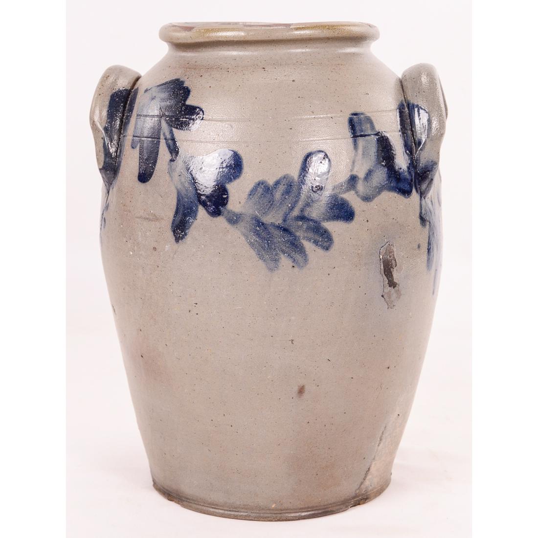 2 Gallon Decorated Floral Blue Stoneware Crock Jar: 2 Gallon Decorated Floral Blue Stoneware Crock Jar with handles. 11 1/4" T x 9" W. Cobalt blue floral design all they way around! With a front 1 1/2" manufacturing blemish. Chips on the rim and bottom