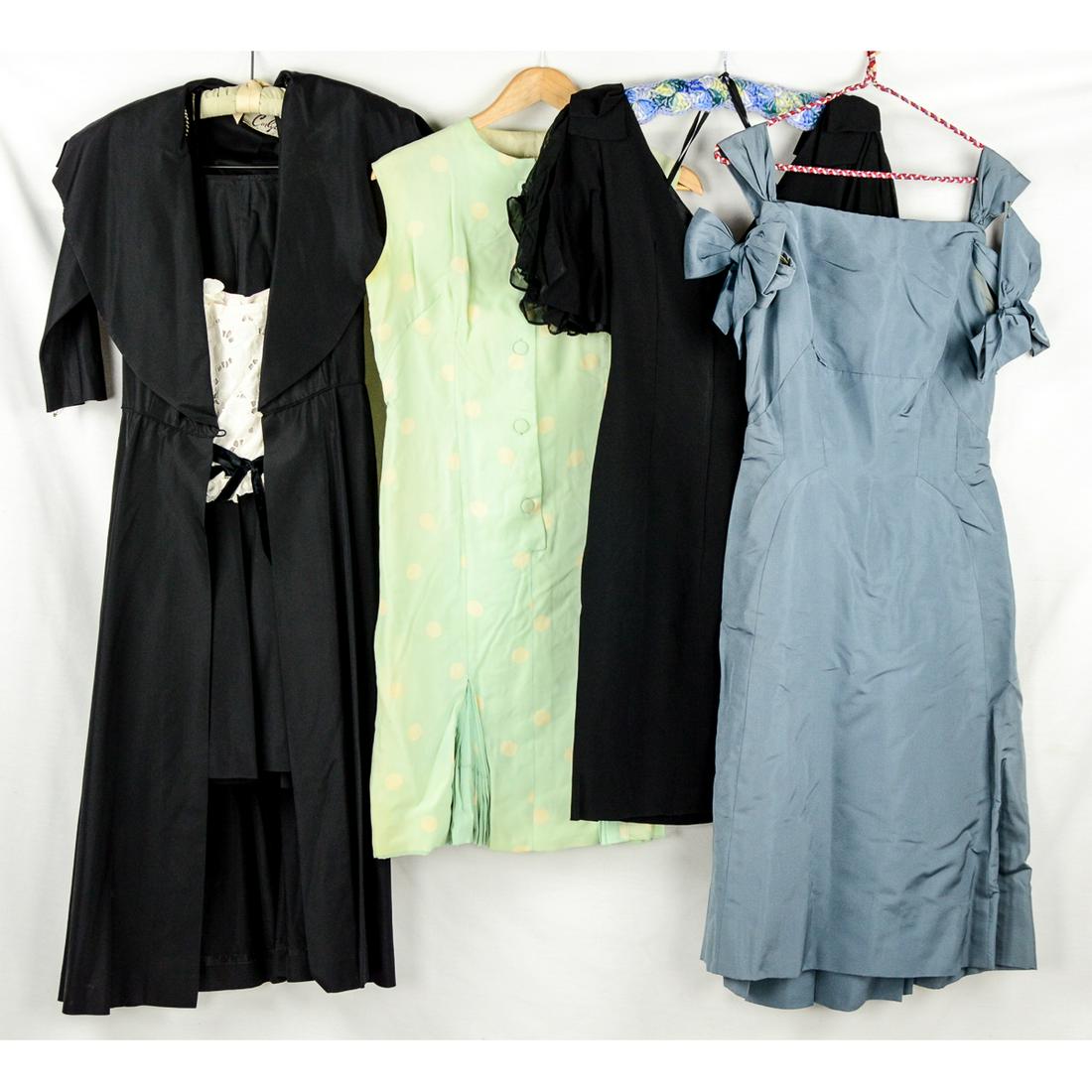 4 1950's-60's Ladies Wear: Little Black Dress, crepe sheath with large bell sleeves, back metal zipper, v-neck, 26" waist, in excellent condition. Silver blue cocktail dress with peek-a-boo sleeves, back metal zipper, some unde