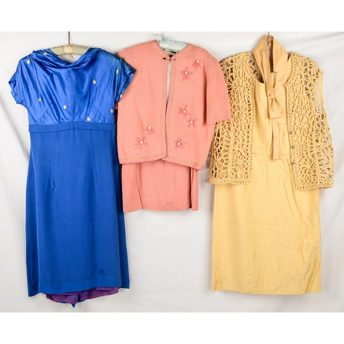 Lot of 3 1960s Ladies Outfits: Three piece peach Susan Thomas outfit. Includes straight linen skirt, White linen blouse with peach trim at collar and hem. Comes with matching knit sweater with embroidered straw daisy flowers up the