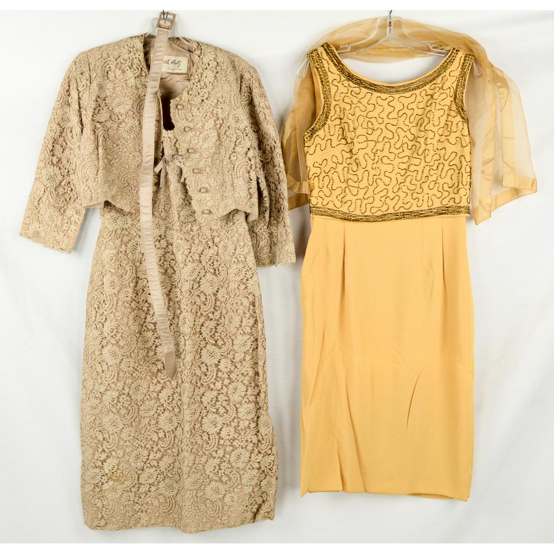 Two 1960's Cocktail Dresses: Four piece "Beth Fritz" from the Drake Hotel, downtown Chicago, sheath dress with lace overlay, includes jacket, original belt, and matching scarf. Waist size 28". Small lace repair needed to bottom b