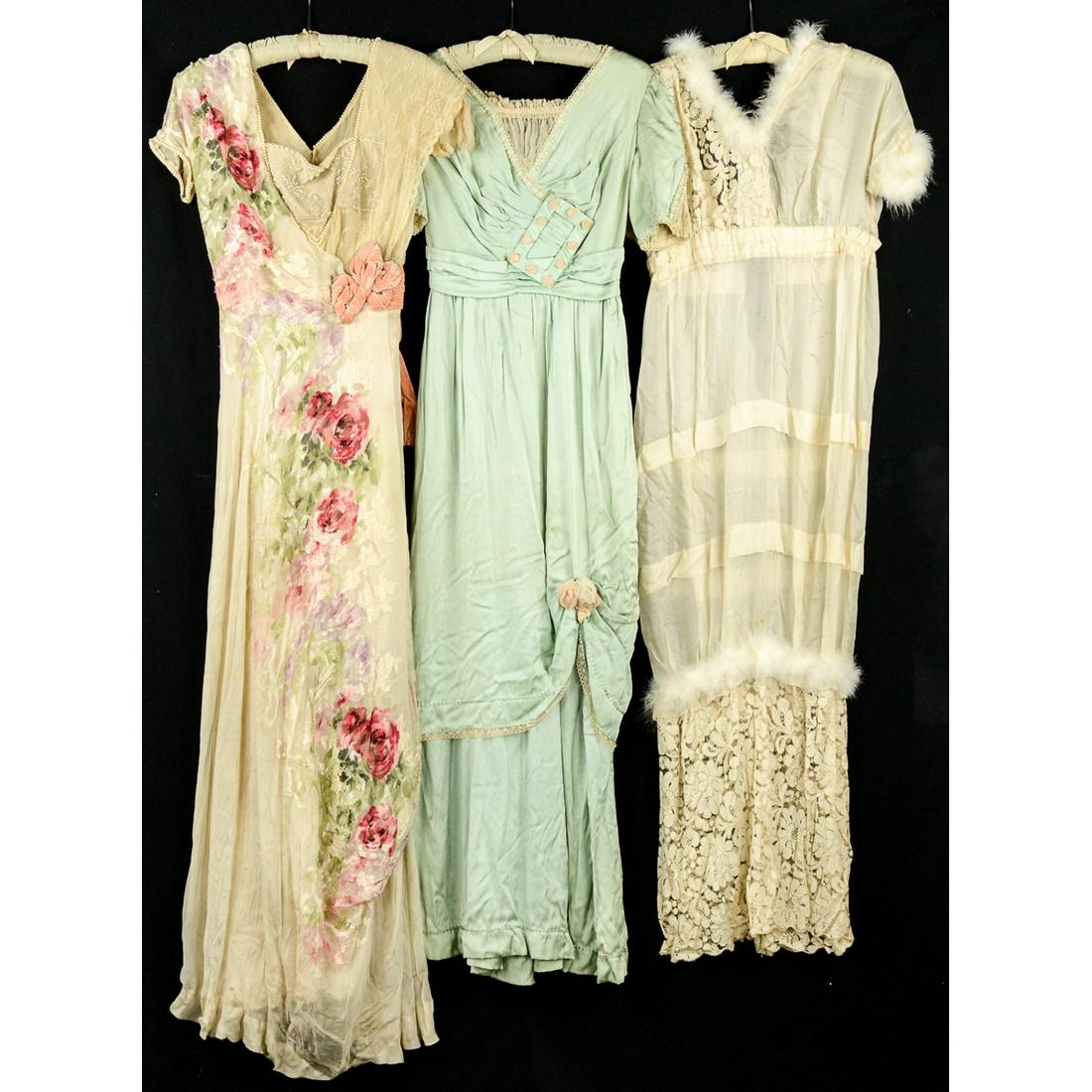 3 Titanic Era Fancy Dresses: Silk floral long gown trimmed in pearls, with a velvet belt. 25" waist. Embroidery and beading is gorgeous. Silk under slip in bad ship. Baby blue ball gown with white silk insets at the sleeves and n