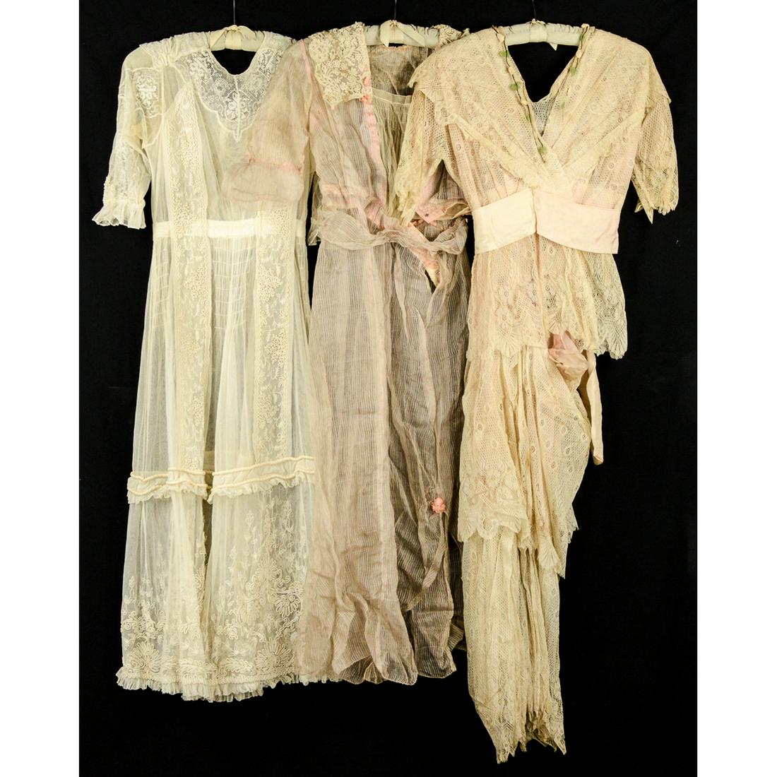 3 Titanic Era Fancy Dresses: Off white French lace and embroidered net dress. Very sheer. Fabric is strong. No stains. 25" waist. Sheer pink and off white striped fancy dress. French lace sailor's collar. Repair to the sleeve. No