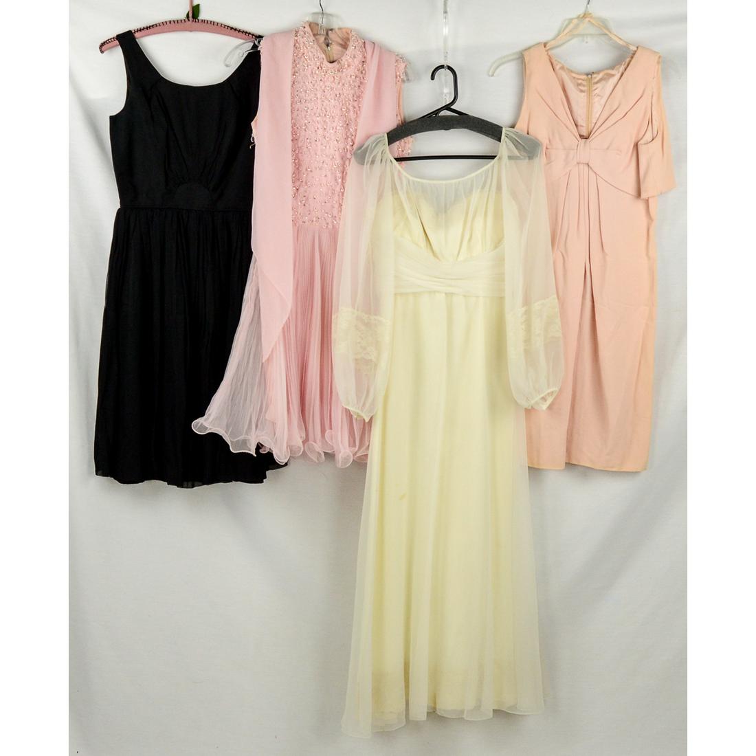 4 Late 1950-early 60s cocktail dresses: Light pink, sleeveless v-neck, crepe cocktail dress, back metal zipper. excellent condition with a 28" waist. Black sheer overdress, full pleated skirt, label reads: "Jo Jr. Dallas", to be worn with l