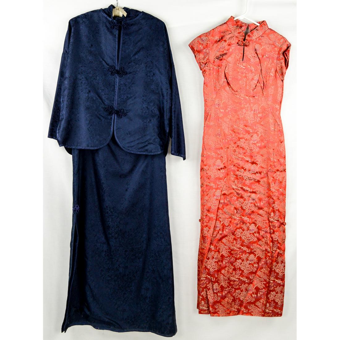 2 1950s Asian Inspired Formals: Bright Red sheath style, high collared formal with frog closures and double side slits. Back metal zipper, 28" waist, in excellent condition. Navy blue jacquard print 2-piece formal, generous sized, 4