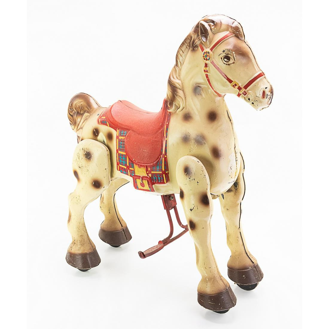 Vintage Mobo Childs Bronco Riding Horse Toy: Made of pressed metal on wheels by Sebel & Co. 30" T x 27" L x 12.5" W. Original paint in good condition with minor scuffs. Missing reins. In working condition. See photos.