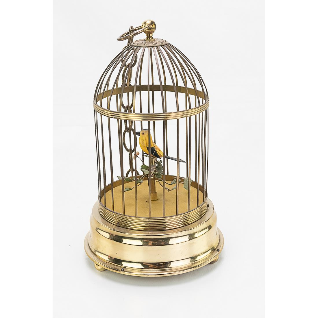 German Automaton Singing Bird in Cage: This automaton bird in cage is not currently working. the spring has been over wound. It is marked "Made in Germany". It measures 7"W x 11 1/2"H.