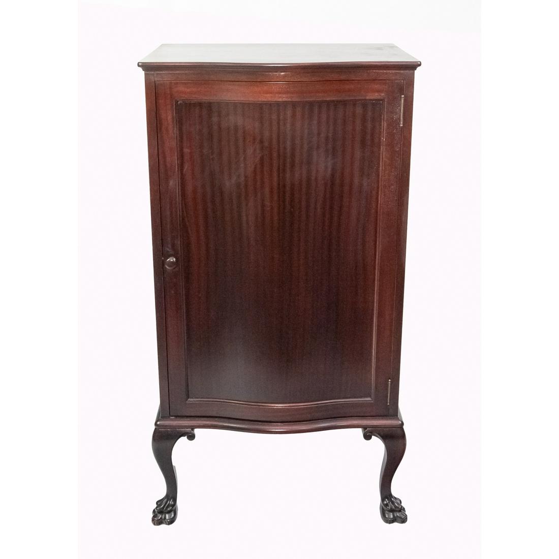 Mahogany Bow Front Music Cabinet w/Claw Feet: This attractive cabinet with rich, ribbon-cut mahogany veneer has original finish, however, it's been cleaned and recoated sometime in the past. The interior features 8 compartments with 7 shelves for