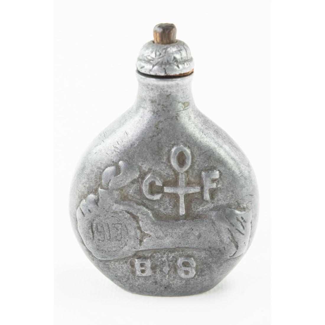 WWI Polish Pewter Flask Trench Art: This polish flask has been carved and dated 1918 with the initial B.S, and a cross with O.C.F. around it. On the reverse is a coat of arms with the slogan "Boze Szczesc Polsce". It measures 2 1/4"W X 