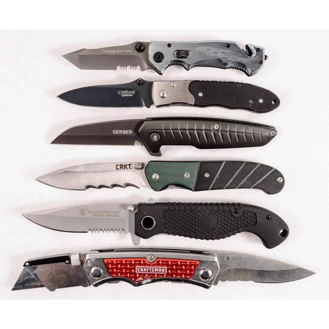 8 Folding and Fixed Blade Knives: Includes a small Gerber Paraframe in good condition, a Smith & Wesson SWAT in good condition, a MAXAM U.S.A., a Chipaway Cutlery fixed blade with sheath, a KSP Swiss Army style with sheath, a Camillus