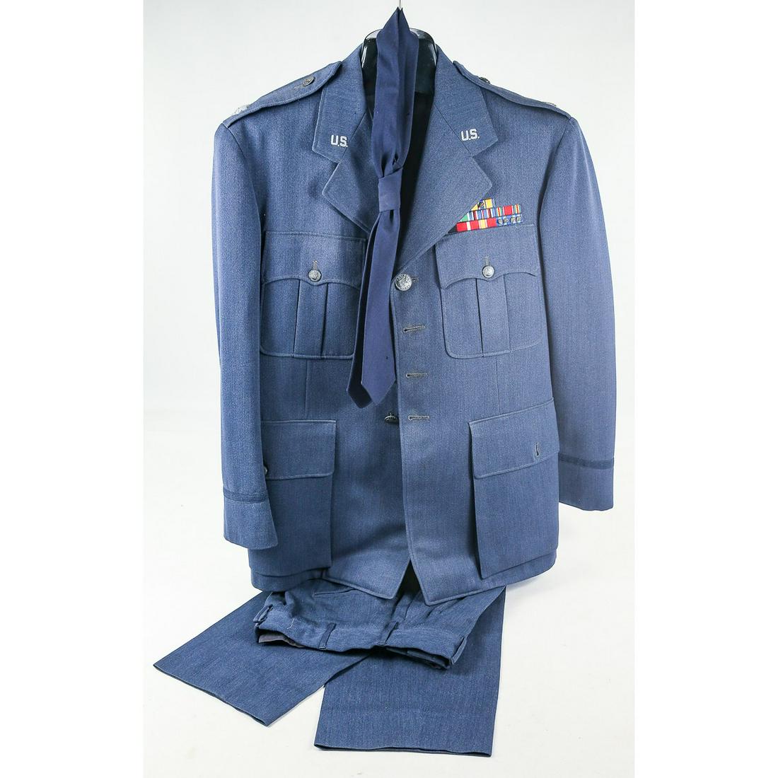 US Air Force Officers Dress Uniform: This uniform is identified to a Lieutenant Colonel Weils and dated from the 1950's The tunic is a size 39S. It was hand tailored by Carey of Baltimore and features bullion collar insignia and bullion