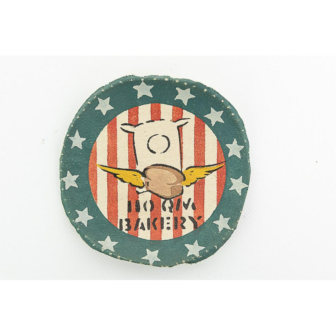 Very Rare WWII Painted 110 Quartermaster Patch: This patch was painted in the field, on cloth. This type of patch was not regulation and would be made to adorn flight and field jackets. The 110th Quartermaster's motto was Toujours La which translat