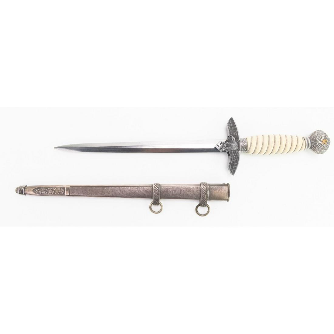 WWII German Luftwaffe Officers Dagger: WWII German Luftwaffe Officers Dagger maker marked "WKC" with Knights Head logo, nice white handle with external parts showing silver tarnish/age patina. There are some scuffs and scratches, consisten