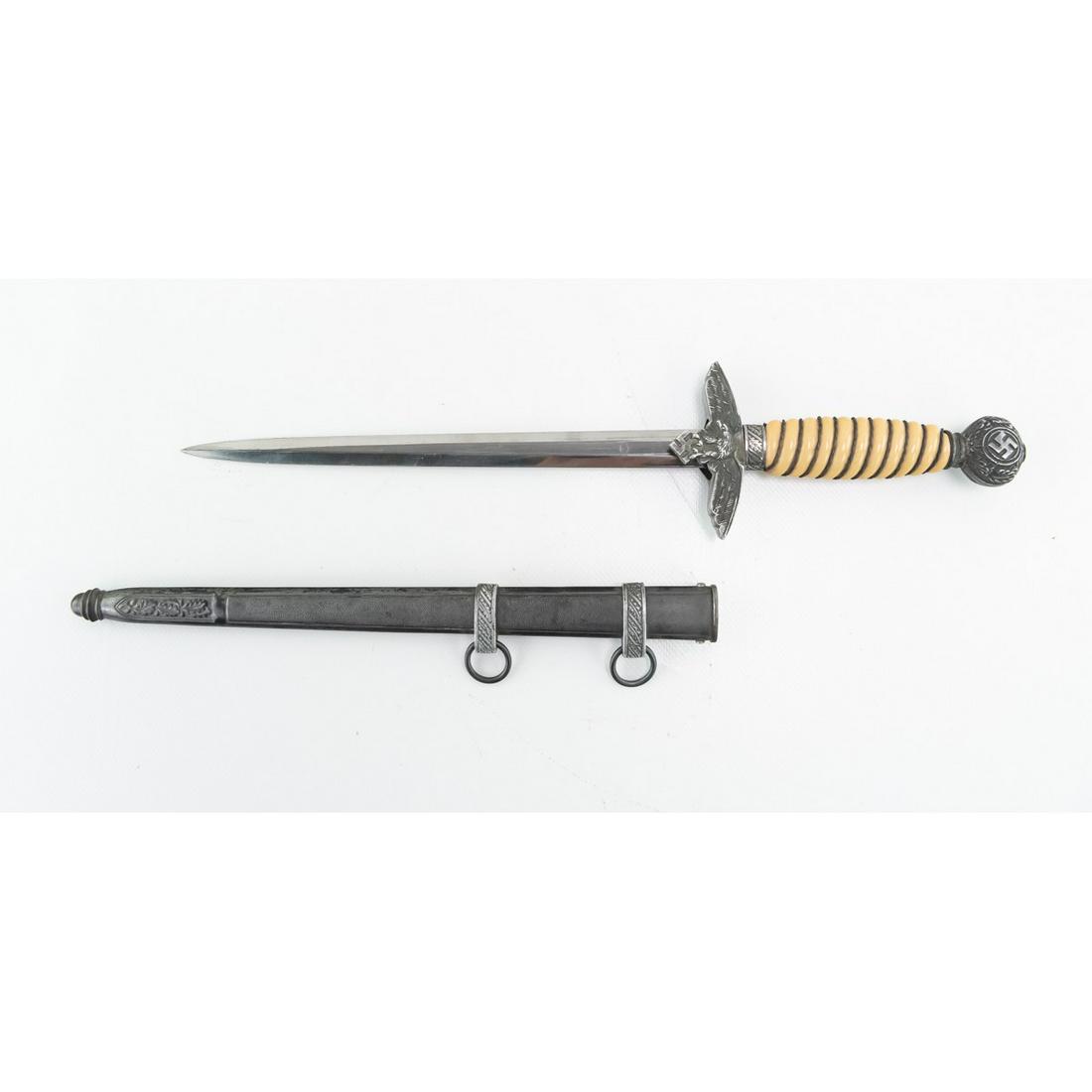 WWII German Luftwaffe Dagger: With a manufacturing mark of J A Henckels, this dagger measures 15 1/2"L with a blade length of 10"L. The pommel, when tightened, is not straight. Disclaimer: Due to the high quality of WWII German fa