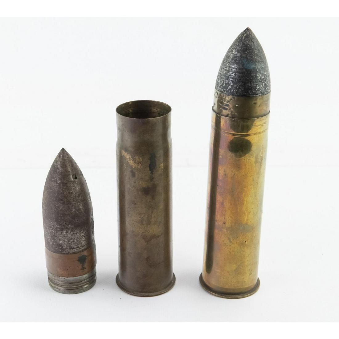 WWI US 1Pounder 37mm Inert Rounds 2Pcs: One was manufactured in Bridgeport Connecticut and the other at Washington Naval Yard. The longest measures 9 1/8"L.