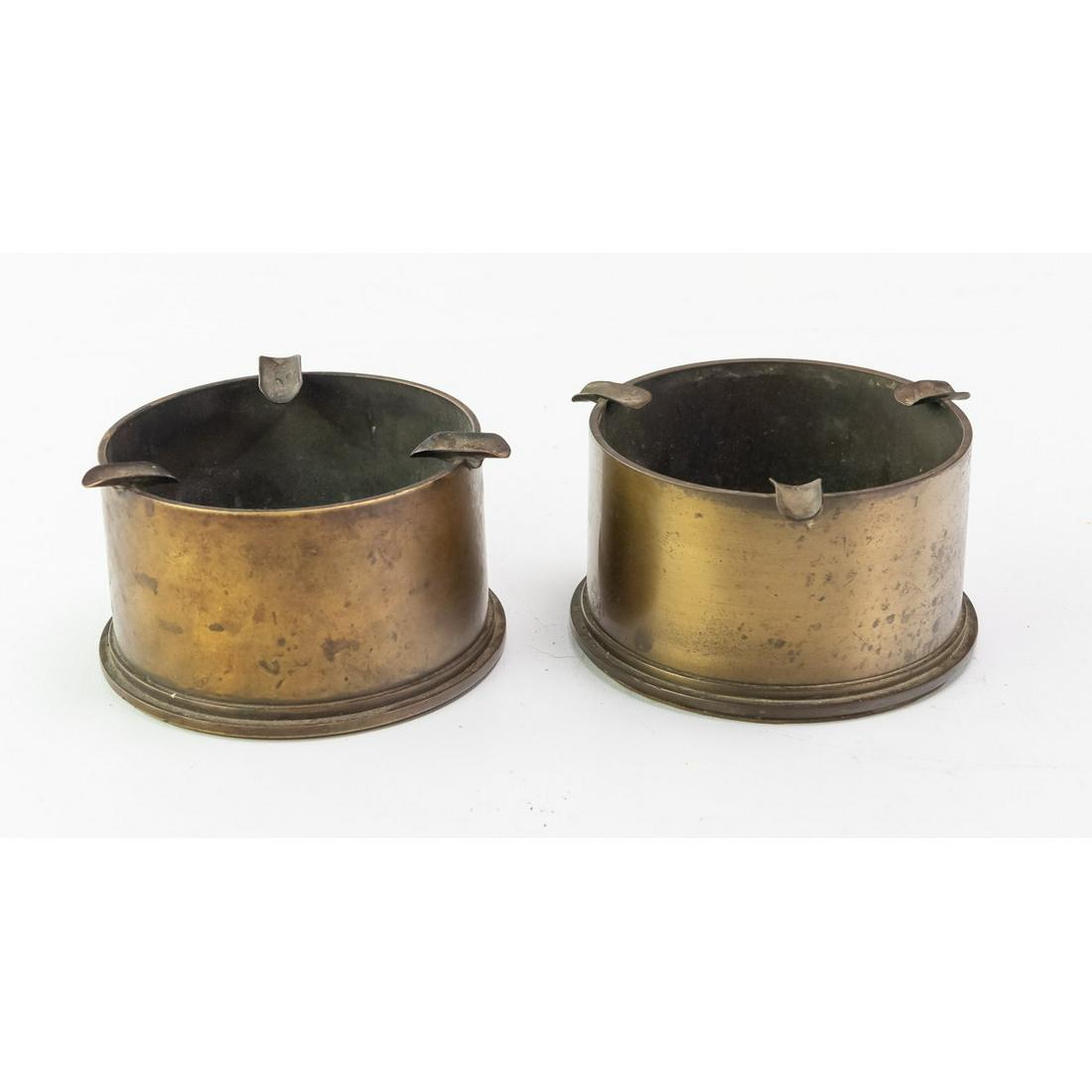 WWII 5" Shells Trench Art Ashtrays 2Pcs: This lot is a pair of 5 inch naval shells turned into ashtrays. Each measure 5"W X 2 7/8"H.