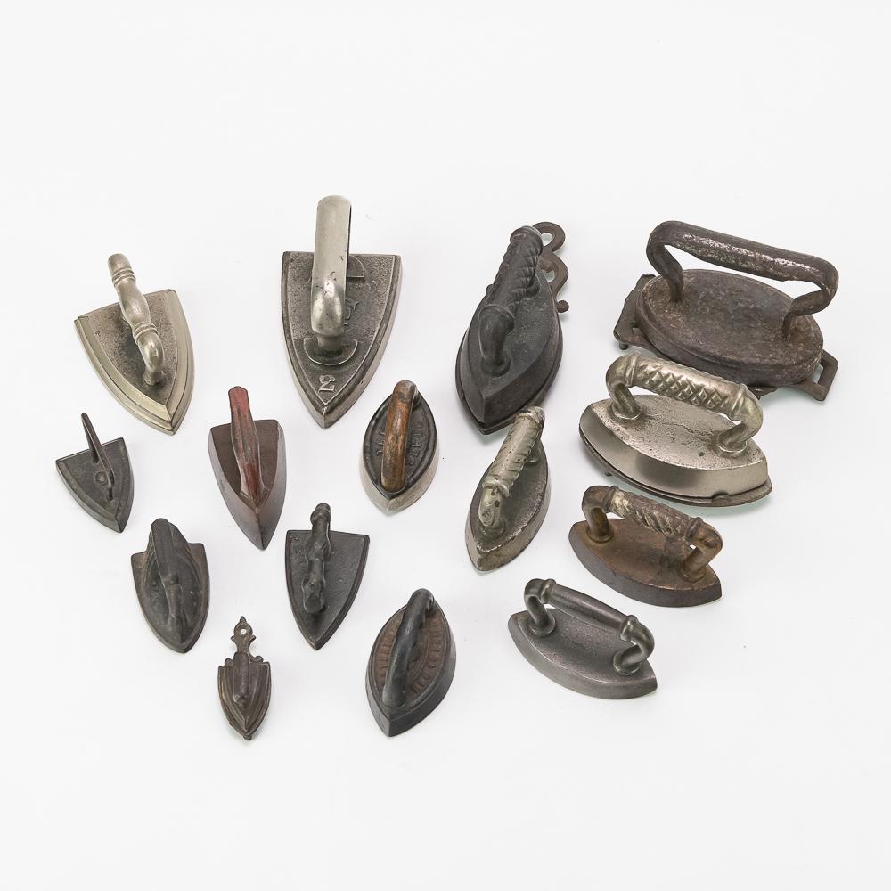 Small Cast Iron Trivets and Irons 17 Pieces: Includes 4 trivets, and a C F iron, an Enterprise iron, The Jewel iron, and more.