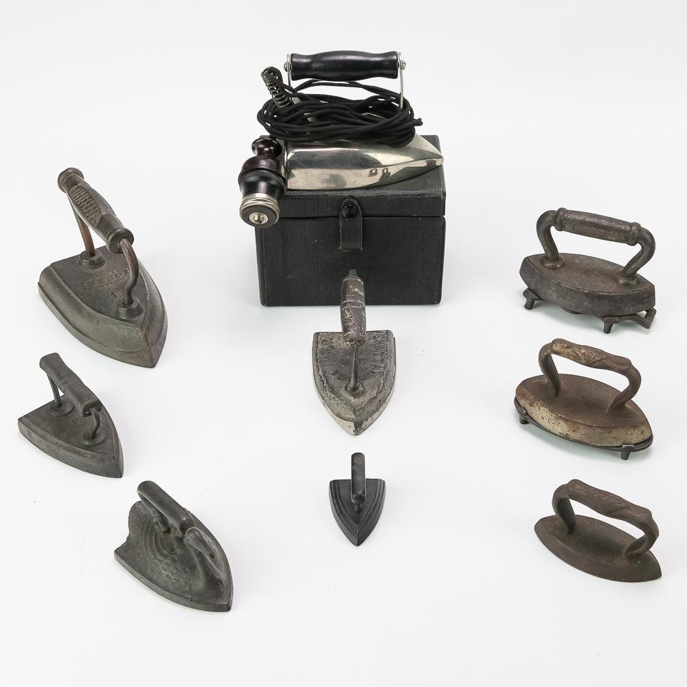 Small Cast Iron Trivets and Irons 10Pcs: Includes an Ober iron, Chattanooga Implement and Mfg Co., Williams Trivet, a small electric iron in box, and more. There is also a blue glazed ceramic iron. ceramic