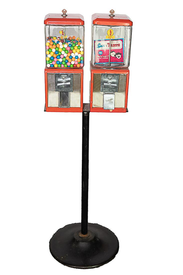 Double Coin-Op Bubble Gum & Candy Machine w/Stand: Double Coin-Op Bubble Gum & Candy Machine w. Stand. Made by Northwestern. 47" T x 14 1/2" W x 6 1/2" D. Left machine missing the gum drop door. Both have expected scratches. Both coin mechanisms a