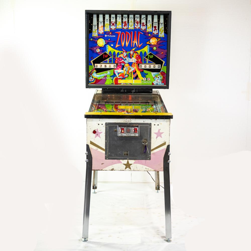 William's 'Zodiac' Pinball Machine: Pitch bat/pinball. One of the first machines that uses magnet lock, crazy scoring feature. All redone cleaned and tested. New posts on center spinner, all new bulbs, good play field, back/cabinet glas