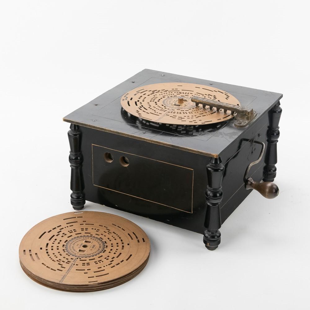 Brevete SGDG Organette w/9 Cardboard Discs: This machine has its original black paint and pinstripes. Overall good condition with a few scrapes and marks. Comes with 9 original cardboard discs. Has evidence of some rebuilding. It does play weak