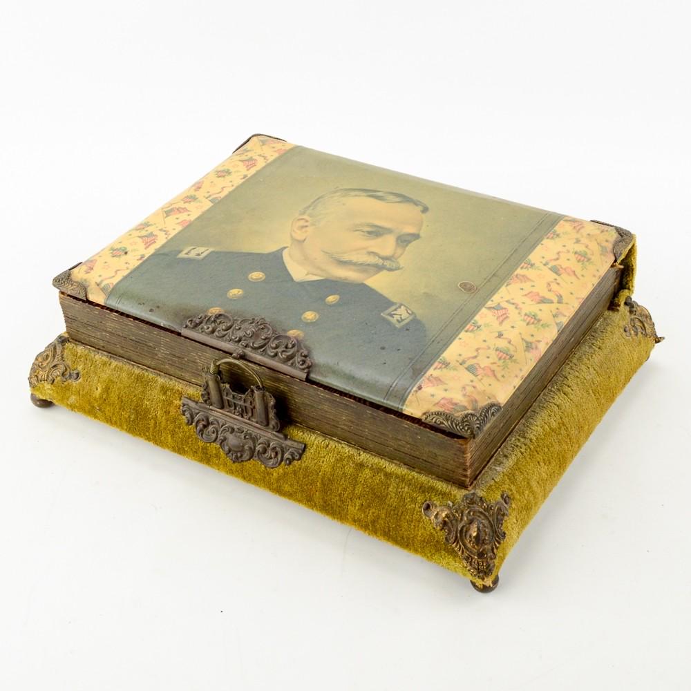 Admiral Dewey Musical Photo Album: This interesting photo album is in as found original condition. This album is most likely from late 1890's after the sinking of the USS Maine in Havana Harbor. The top cover has a celluloid image of A