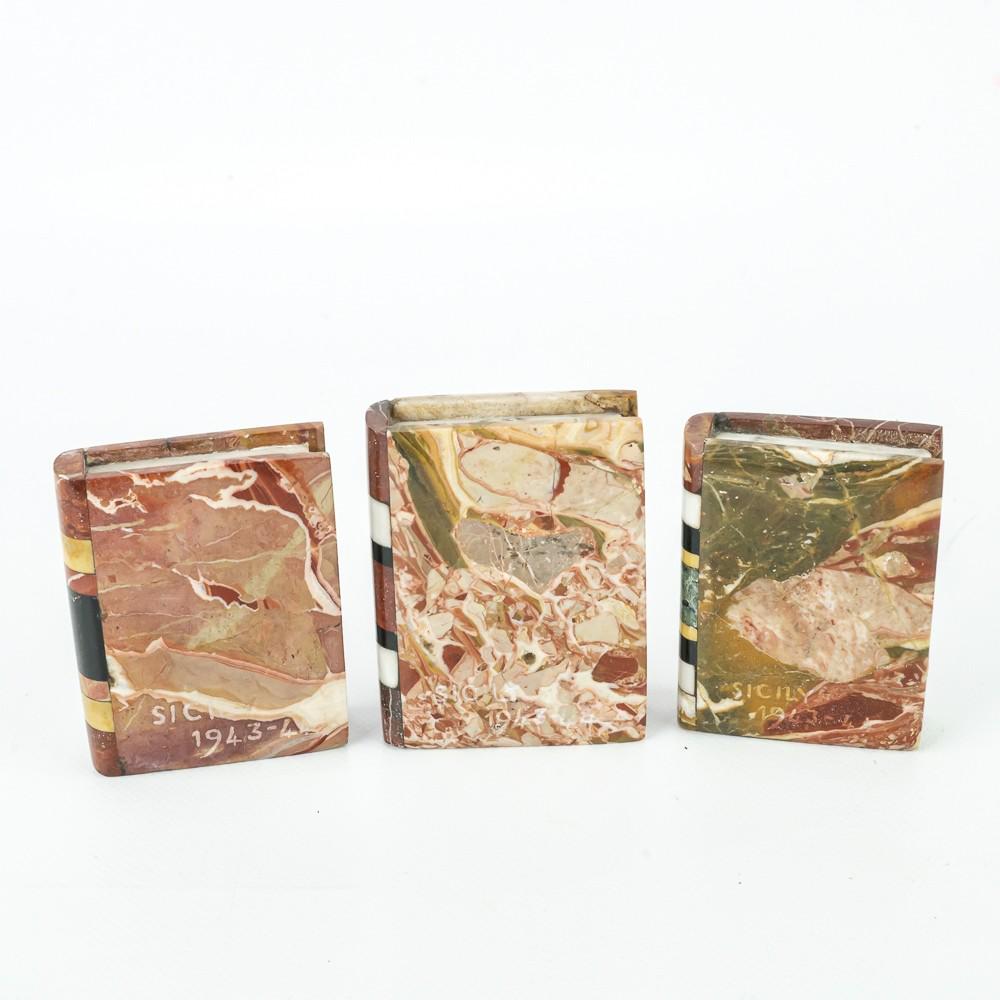 (3) 1943-44 Mini Marble Bookends from Sicily: Nice collection of (3) mini marble bookends from Sicily. Each has 1943-44 Sicily etched on the cover and are approximately 3.5" X 2.5". Present well and in very good overall condition. Please see phot