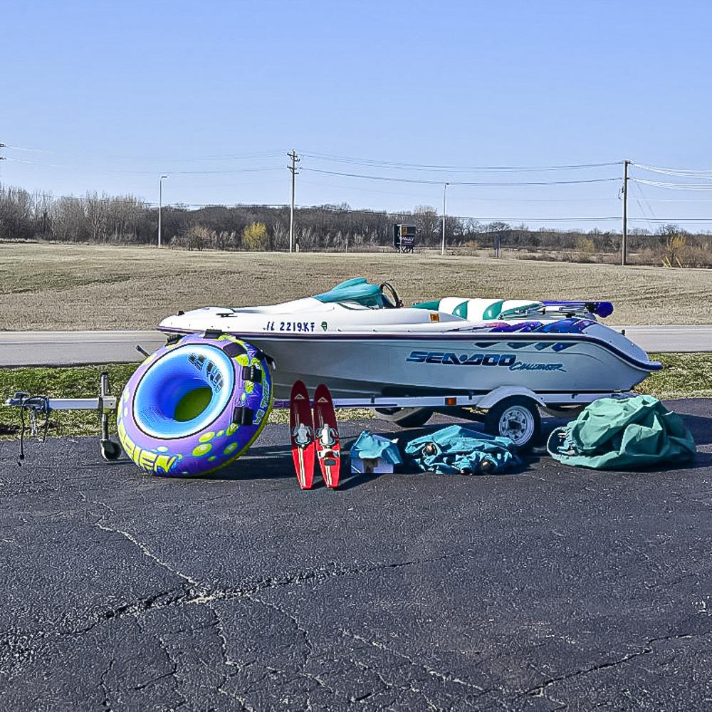 1996 SEA-DOO Challenger Jet Boat/Trailer/Access: 14 ft. fiberglass single engine, jet drive. Boat in very good condition aside seat material but a complete factory set is in box. New complete snap on cover with stanchion poles, tonneau cover, bimini