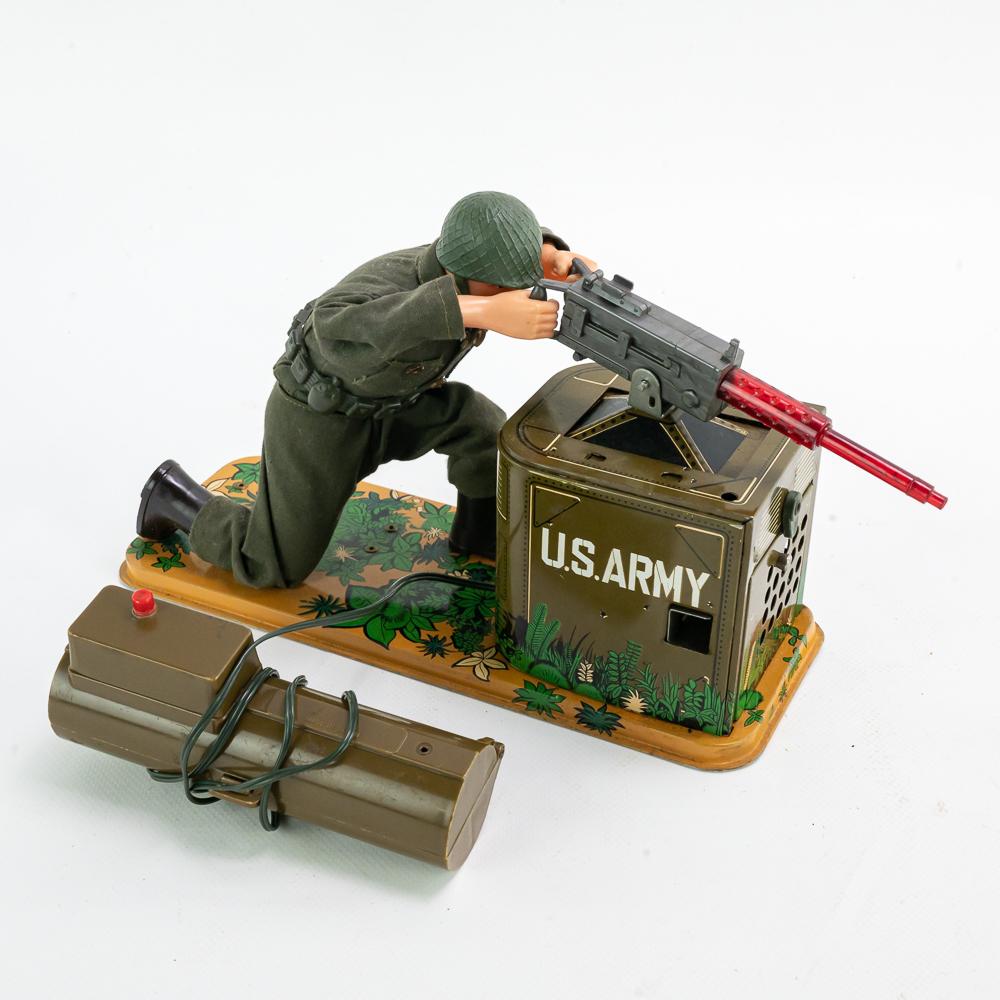 1960s Tomy Japan Battery Operated Combat G.I. Toy: Hard to find 1960s Combat G.I. original tin toy. In very good to good overall condition with minor blemishes noted. Light surface wear indicative of age and use present. Battery compartment is clean a