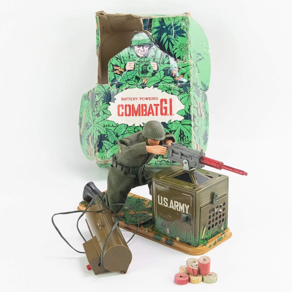 1960s Tomy Japan Battery Operated Combat G.I. Toy: Hard to find 1960s Combat G.I. original tin toy with original box. In very good to good overall condition with minor blemishes noted. Battery compartment is clean and rust free. Appears complete with 