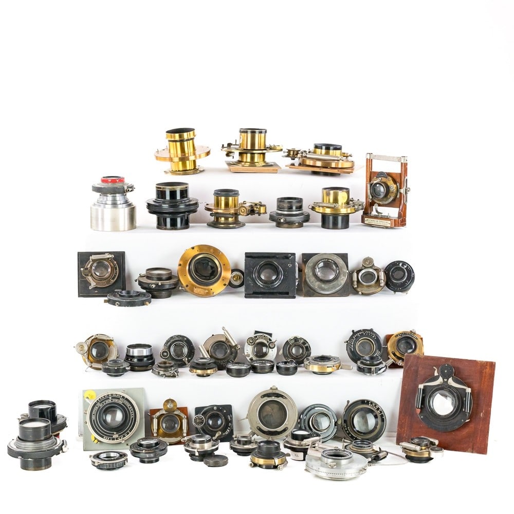 Lenses & Shutters: A quantity of lenses on shutters by; Kodak-Zeiss, Wollensack, an Duplex shutter w/ lens, Bausch & Lomb, Hugo Myer, Unicum, Ilex, Kodak, Manhattan-Wizard, Gorez, Beck, Zeiss, Gundlach, Wunsche, and oth