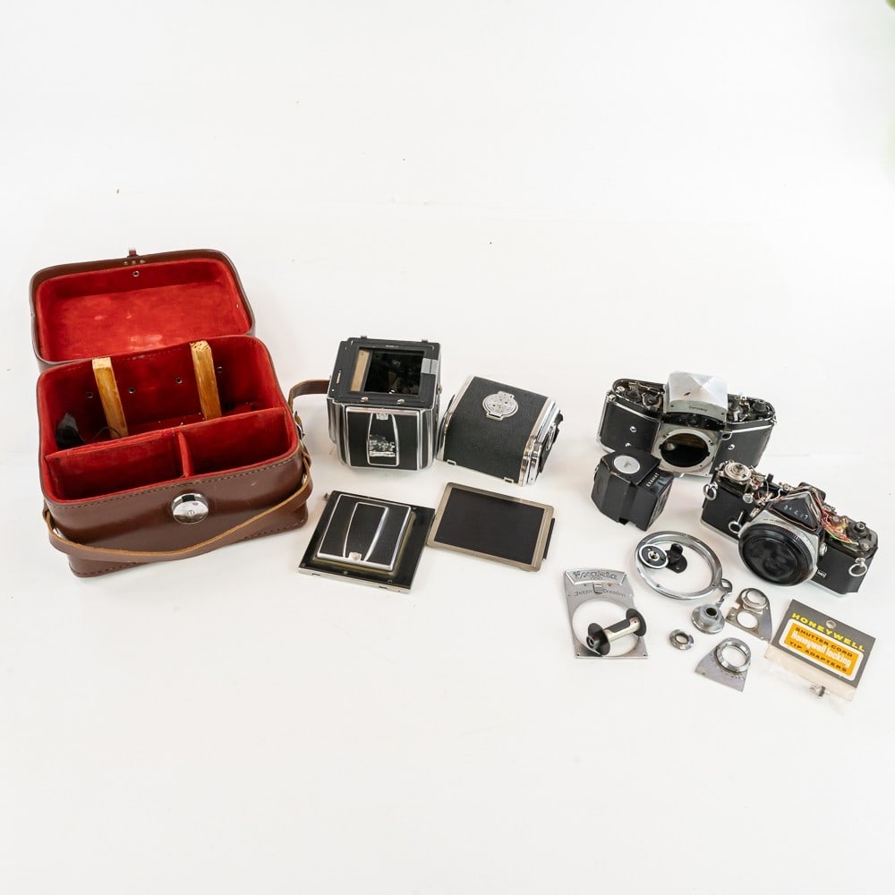Incomplete Cameras: Includes part of a Hasselblad 1000F in case, an incomplete Exakta, and an incomplete Olympus