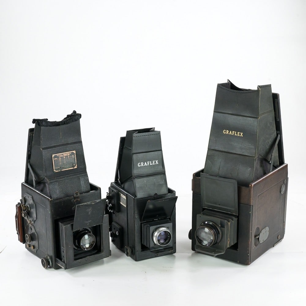 Three Graflex Cameras: An RB Series B 4 x 5 with Bausch & Lomb Tessar Ic 5 x 7, an RB Series B 3 x 2 1/4, with Kodak Ektar f 4.5 127 mm lens, and a Auto Graflex 3 1/2 x 4vwith Wollensak Velostigmat Series II f 4.5 8 inch le