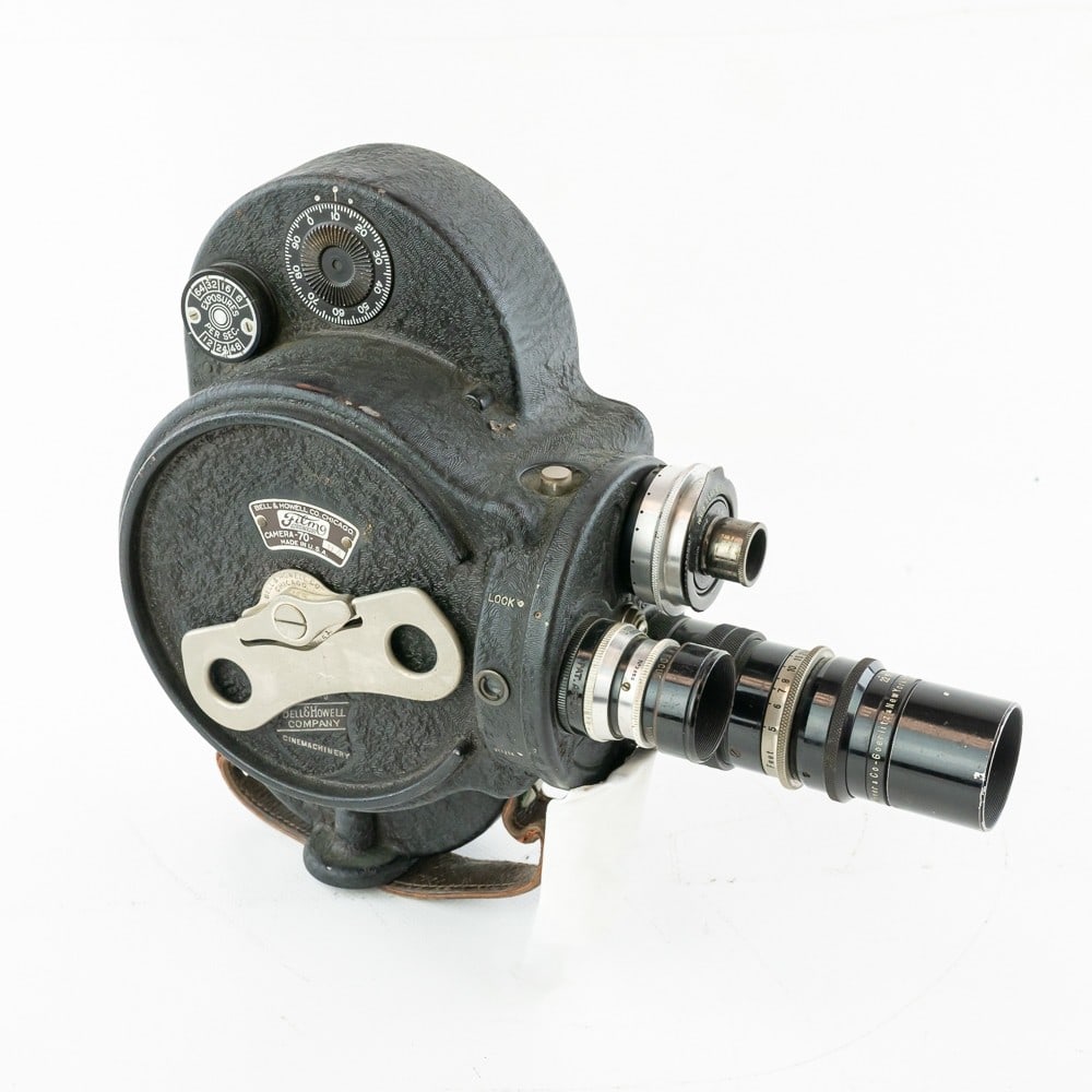 Bell & Howell Filmo 70 DA Movie Camera: With three lens turret containing a Hugo Meyer Tele Megor f 4 4 inch, a Wollensak Cine Volstigman f 1.5 1 inch, and a Cook Cinema f 3.5 1 inch.