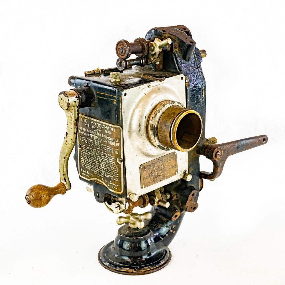 Motiograph No. 2 35 mm Motion Picture Projector: Model 1909, No. 92382,by the Enterprise Optical Mgf. Co., Chicago, the head with mechanism, lens holder, and Motion Picture Patents Co. plaque.