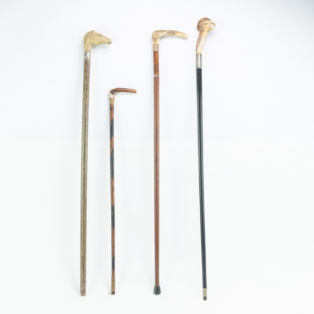 (4) Stag Handle Canes: All four are in good condition showing only use. Cane lengths are from 27" to 36". Please review photographs.