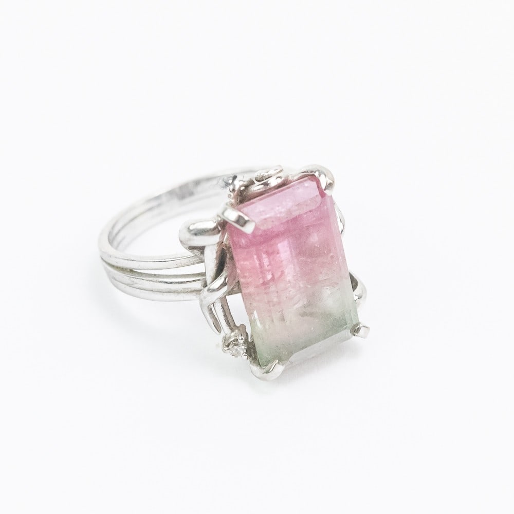 White Gold Bicolor Tourmaline Ladies Cocktail Ring: Unmarked white gold ring set with 1 rectangular step cut bicolor tourmaline measuring 16.21 x 9.92 x 6.6mm, approximate weight 9.41 carats. Approximate weight 5.2 dwt. Approx. ring size: 7.25