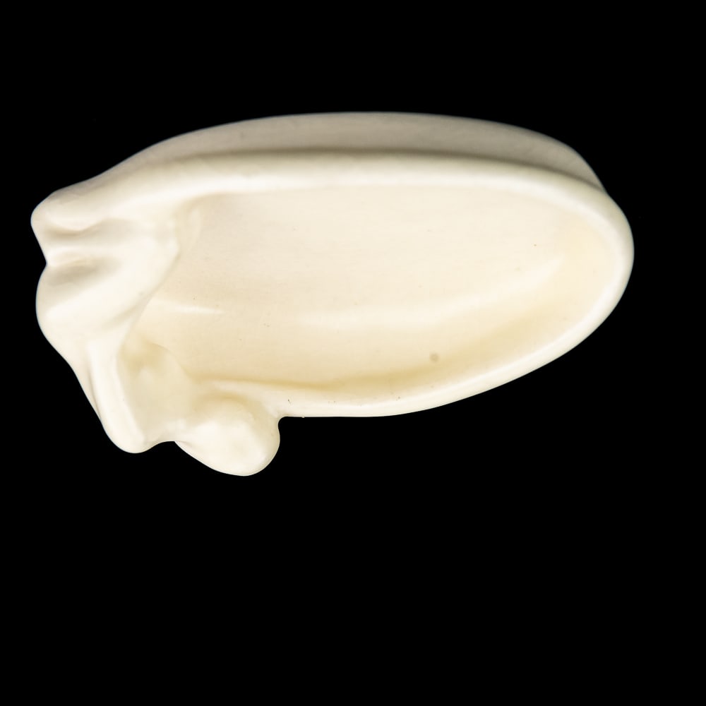 1947 Rockwood Nude Female Porcelain Pin Tray #2595: A 1947 Rookwood pottery pin tray in a white mat glaze featuring a woman’s nude figure reclining across the edge. Very good to good condition with crazing present; no chips or cracks. The Art Deco pa