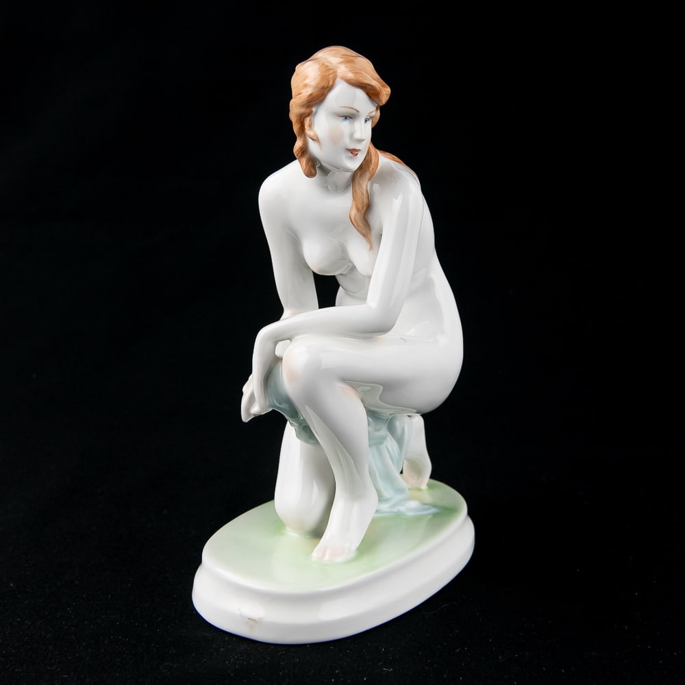 Zsolnay Pecs Hungry Kneeling Nude Porcelain Statue: Antique Zsolnay Pecs Hungry kneeling nude porcelain statue. Stands approximately 9" tall and in very good overall condition with no chips or cracks noted. Three small flea bites noted on models back a