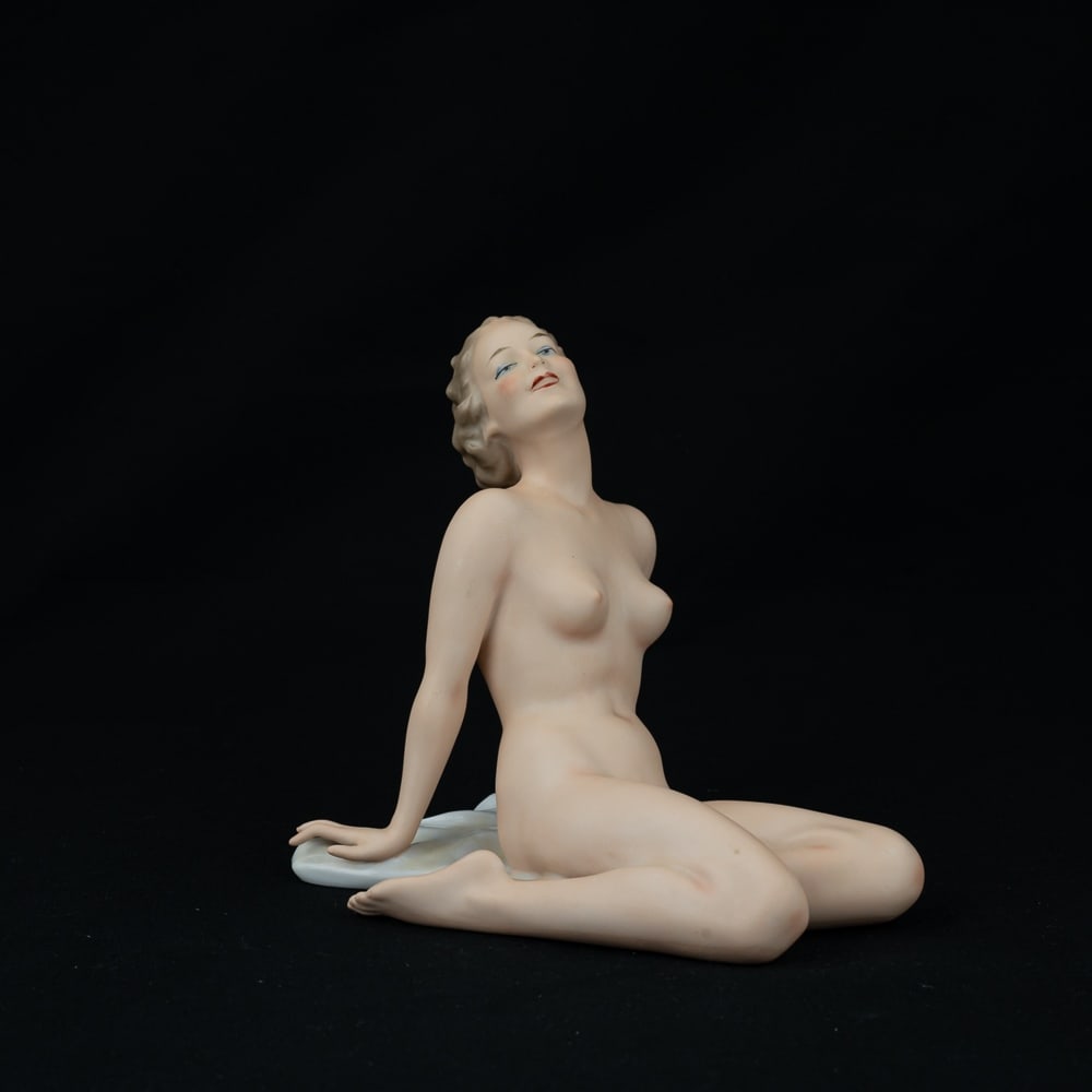 Wallendorf Porcelain Beach Nude Woman 1764 #1527: Very nice vintage art deco Wallendorf Germany porcelain "Beach Nude Woman on a Towel" #1527. In very good overall condition with no chips or cracks noted. Stands 6" tall, Wallendorf 1764 stamped on bo