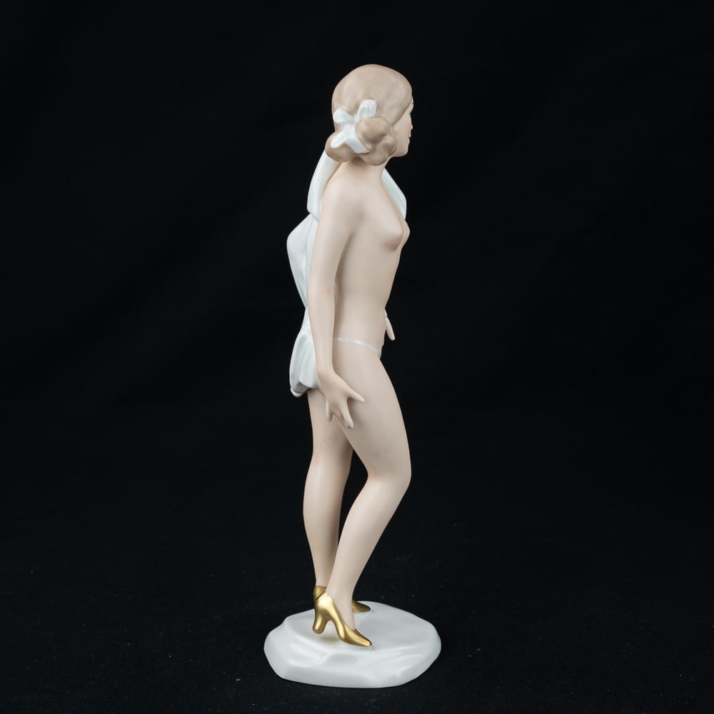 Wallendorf Porcelain Nude Woman Figurine #1942: Very nice vintage Wallendorf Germany porcelain semi nude woman undressing #1942. In very good overall condition with no chips or cracks noted. Stands 11" tall, Wallendorf 1764 1942 stamped on bottom s