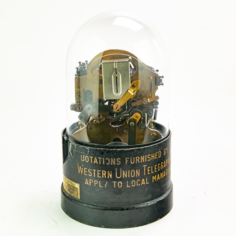 Edison Stock Ticker Tape Machine: All original Edison model 32A ticker tape machine in good condition. All parts seem to be intact including the ink box and paper spool. No ticker paper included. Base in good condition with expected w