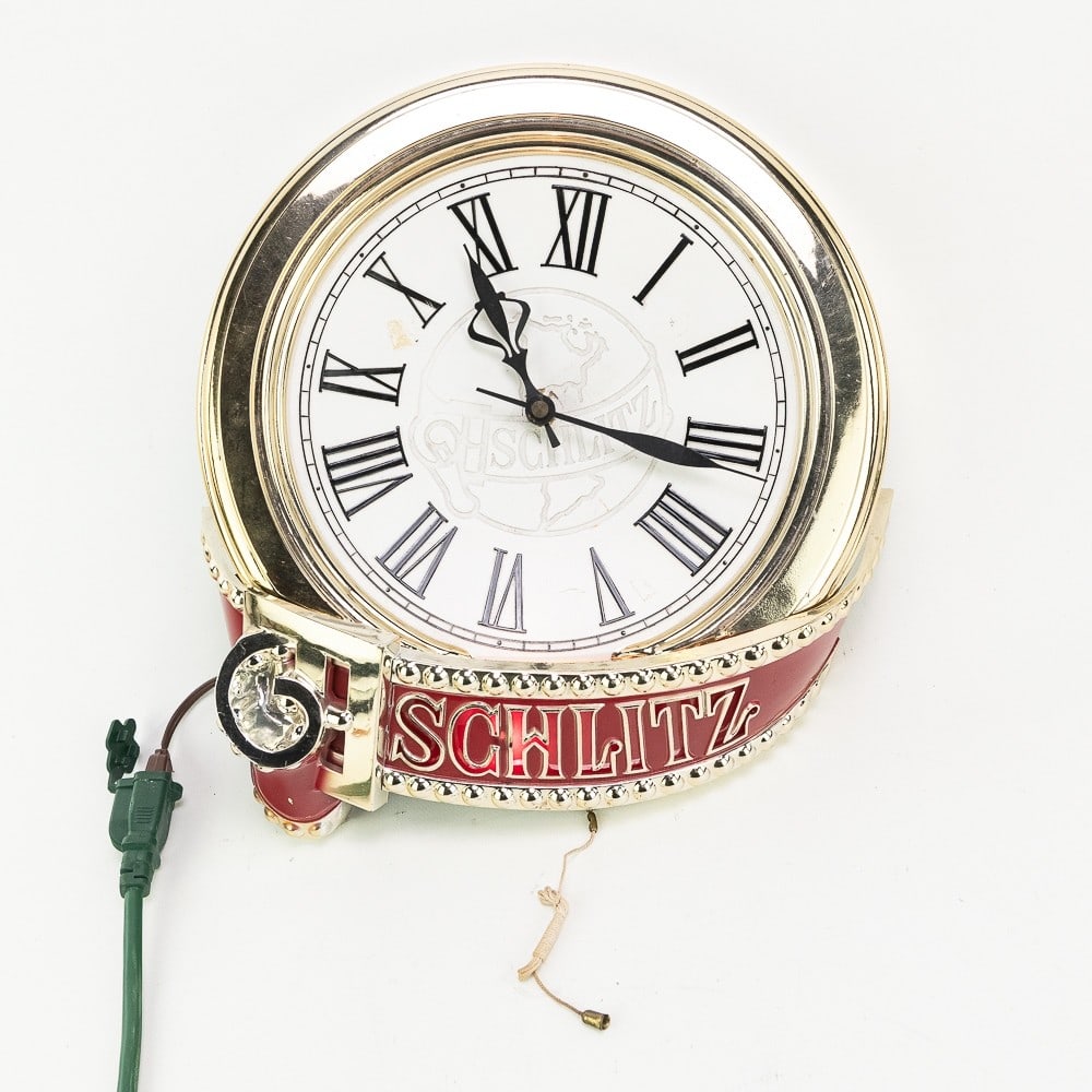 Vintage Schlitz Beer Advertising Wall Clock: Very nice vintage Schlitz Beer Advertising Wall Clock. Works, with some light surface wear and minor blemishes present. Approximately 15" x 13.5". Please use photos to judge condition and bid accordin