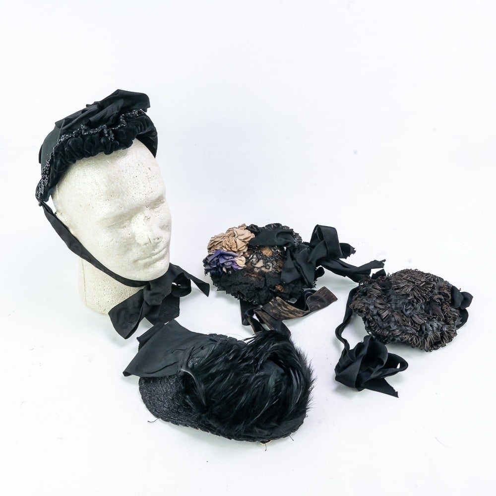 Four Mourning Bonnets 1885-1900: Four mourning bonnets in very good condition to excellent condition. - Black felt head fitting bonnet with gathered velvet and jet bead trim that forms a widows peak in the front. drawstring, silk lin