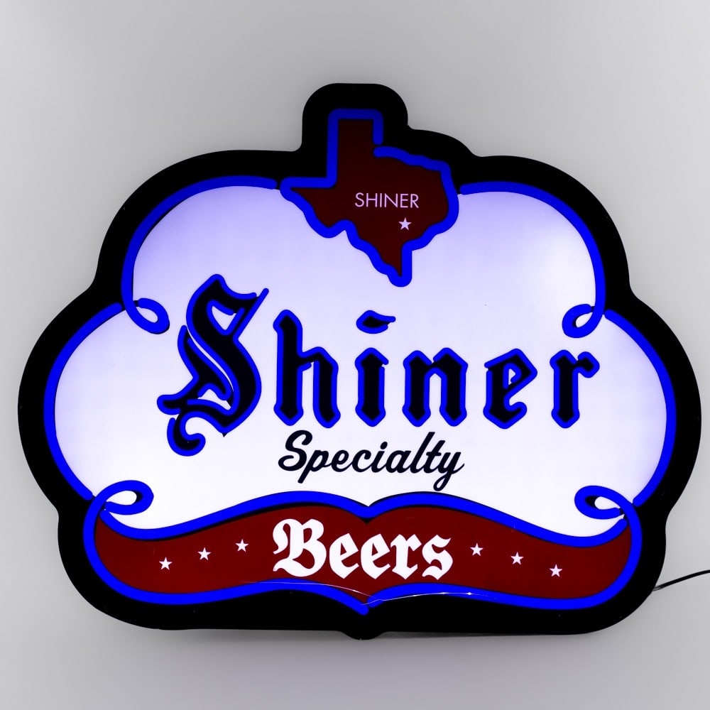 Shiner Specialty Beer Light Up Advertising Sign: Shiner Specialty Beer light up advertising sign. Good overall condition with some wear including surface scratches. Light flashes on and off when plugged in and will require repair. Eye catching color