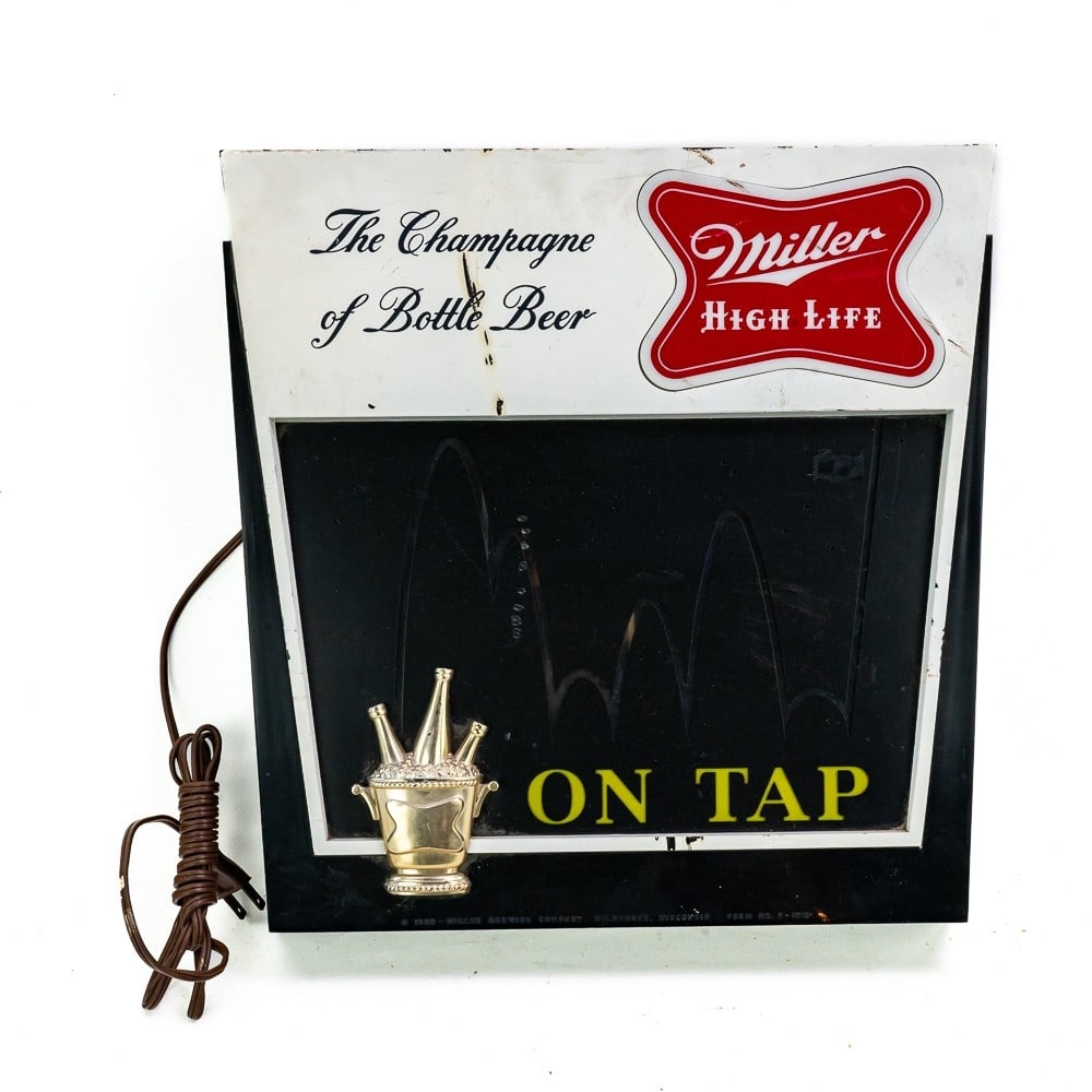 Miller High Life Bouncing Ball Motion Sign: Miller High Life "On Tap" bouncing ball motion sign. Plugs in and lights up, however bouncing ball motion does not appear to be functional. Sign is in rough-to-fair condition, with front showing vario